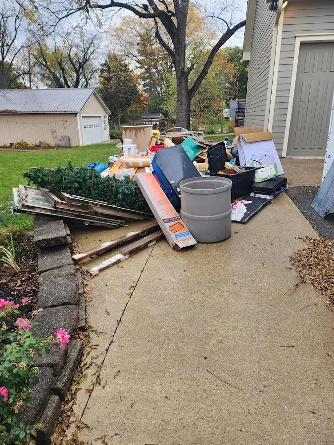 Dumpster being loaded with debris for 30 Yard Dumpster Rental in Mantua